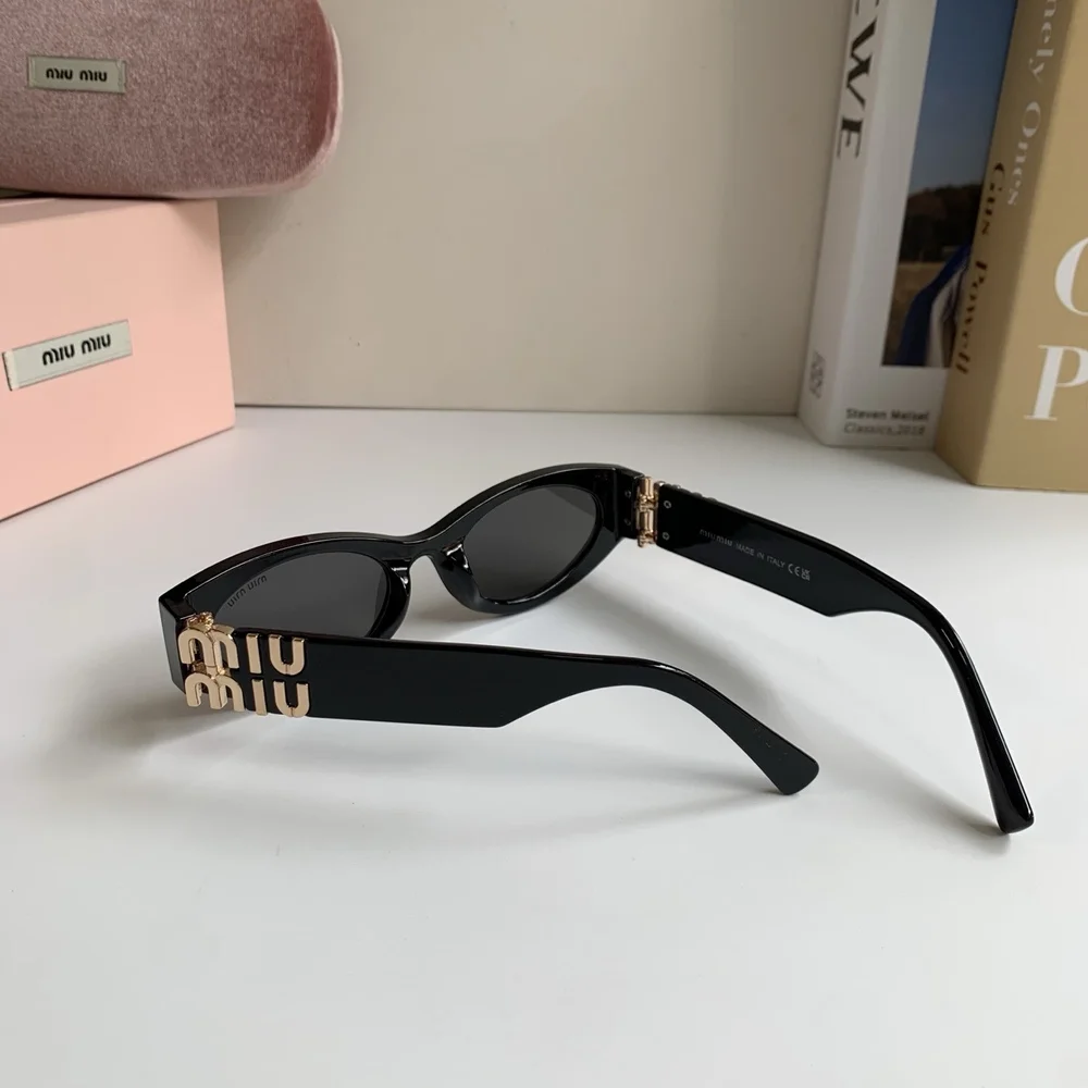 Miu Miu black sun protection sunglasses and aviator sunglasses